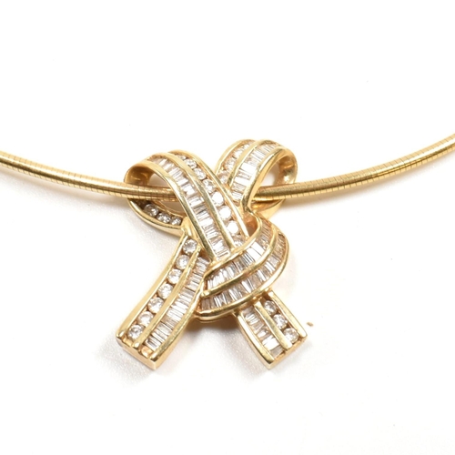 350 - A 14ct gold and diamond ribbon bow pendant necklace. The necklace is strung with a ribbon bow pendan... 