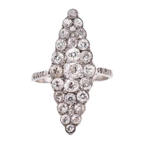 352 - A hallmarked 18ct gold and navette diamond cluster ring. The ring having a navette shaped head set w... 