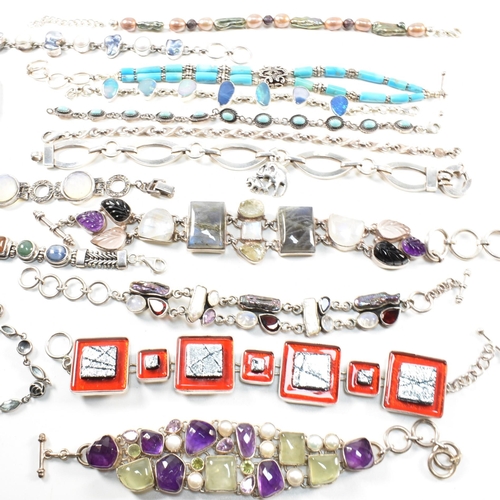 354 - A quantity of silver gem set bracelets and a cuff bangle. The bracelets include charm, gem set pearl... 