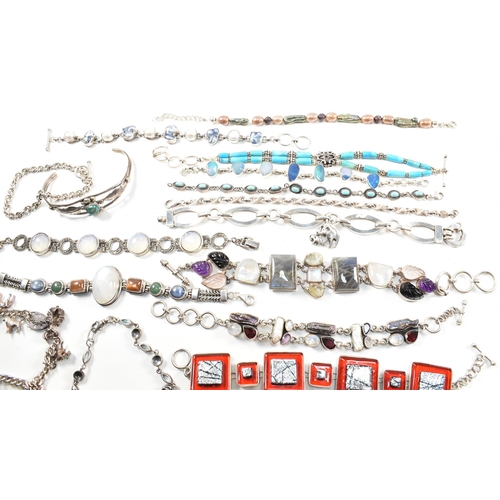 354 - A quantity of silver gem set bracelets and a cuff bangle. The bracelets include charm, gem set pearl... 