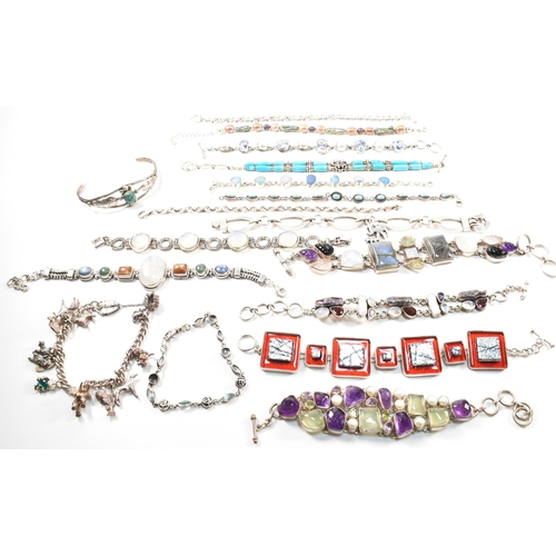 354 - A quantity of silver gem set bracelets and a cuff bangle. The bracelets include charm, gem set pearl... 