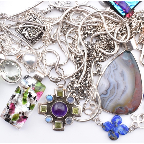 356 - A quantity of 925 silver and white metal pendant necklaces including synthetic opal and cubic zircon... 