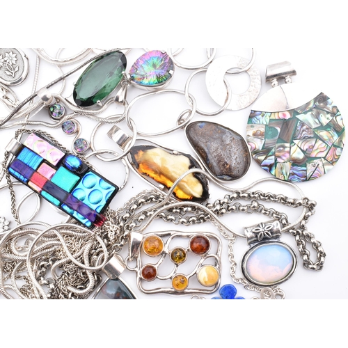 356 - A quantity of 925 silver and white metal pendant necklaces including synthetic opal and cubic zircon... 