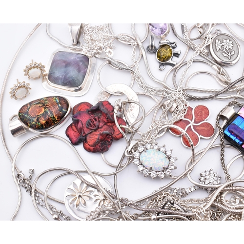 356 - A quantity of 925 silver and white metal pendant necklaces including synthetic opal and cubic zircon... 