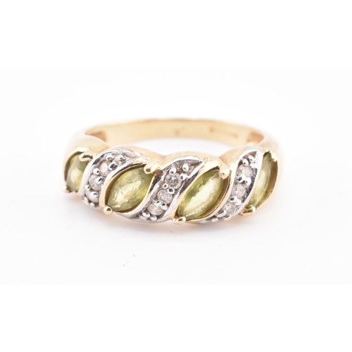 362 - A hallmarked 9ct gold, green sapphire and diamond ring. The 9ct gold ring set with four marquise cut... 