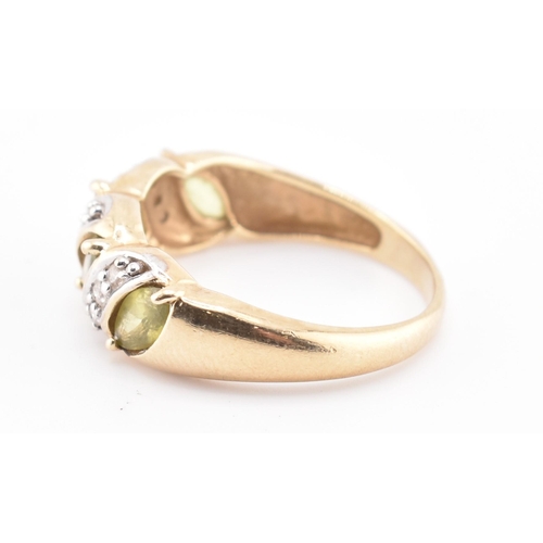 362 - A hallmarked 9ct gold, green sapphire and diamond ring. The 9ct gold ring set with four marquise cut... 