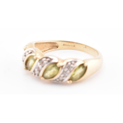 362 - A hallmarked 9ct gold, green sapphire and diamond ring. The 9ct gold ring set with four marquise cut... 