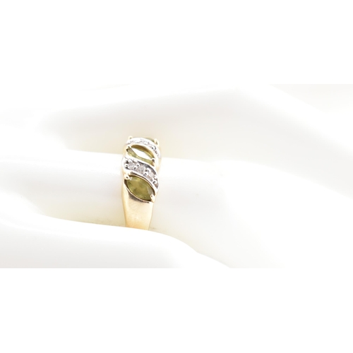 362 - A hallmarked 9ct gold, green sapphire and diamond ring. The 9ct gold ring set with four marquise cut... 