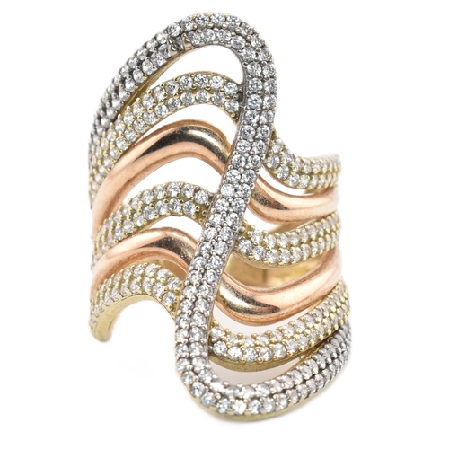 374 - A hallmarked 9ct bi-colour gold and CZ swirl ring. The 9ct gold swirl ring having four yellow gold r... 