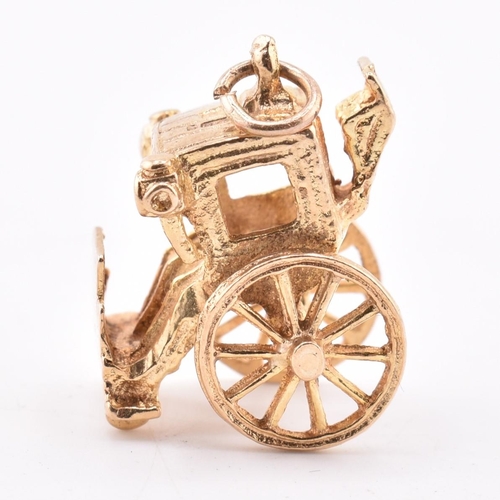 375 - A hallmarked 9ct gold royal carriage charm. Hallmarked for London, 1974. Weight 4.5 g. Measures (inc... 