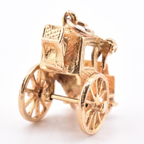 375 - A hallmarked 9ct gold royal carriage charm. Hallmarked for London, 1974. Weight 4.5 g. Measures (inc... 