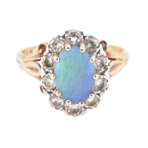 380 - A hallmarked 9ct gold, opal and diamond cluster ring. The 9ct yellow gold ring set with a central ov... 