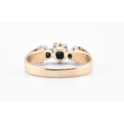 383 - A hallmarked 9ct gold, sapphire and diamond three-stone ring. The 9ct yellow gold ring set with a ce... 