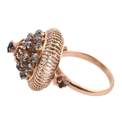 395 - 14ct gold and sapphire cluster ring. The 14ct gold ring having a central claw set round cut sapphire... 