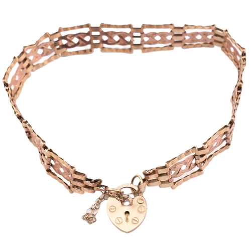 397 - A hallmarked 9ct gold gate link bracelet with heart padlock clasp. The 9ct bi-colour gold gate link ... 