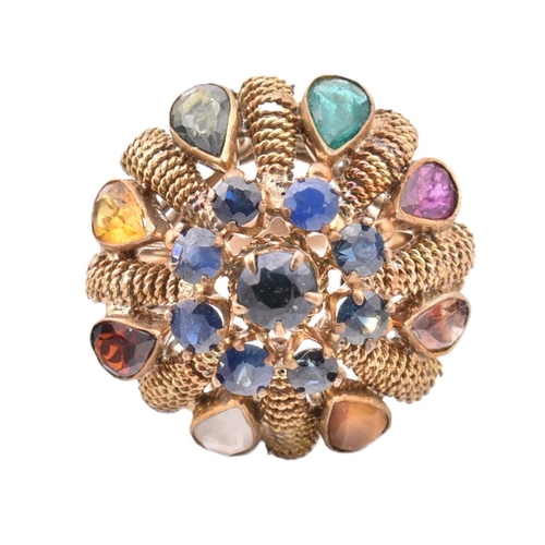 399 - A 14ct gold and multi-coloured gem princess cluster ring. The 14ct gold ring having a central round ... 