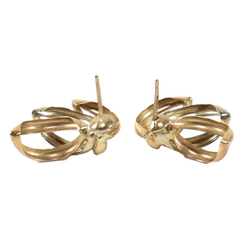 402 - A pair of hallmarked 9ct tri-colour gold wreath earrings. The stud earrings having a laurel wreath d... 