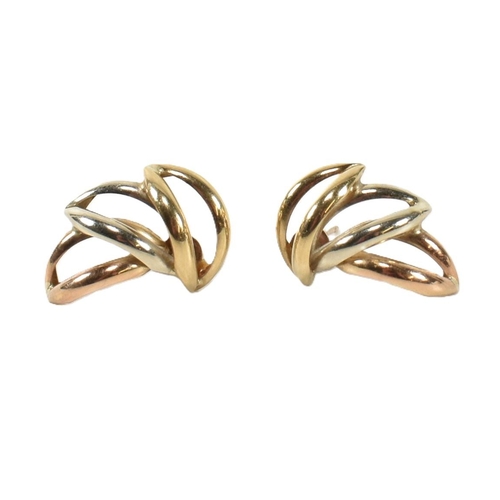 402 - A pair of hallmarked 9ct tri-colour gold wreath earrings. The stud earrings having a laurel wreath d... 