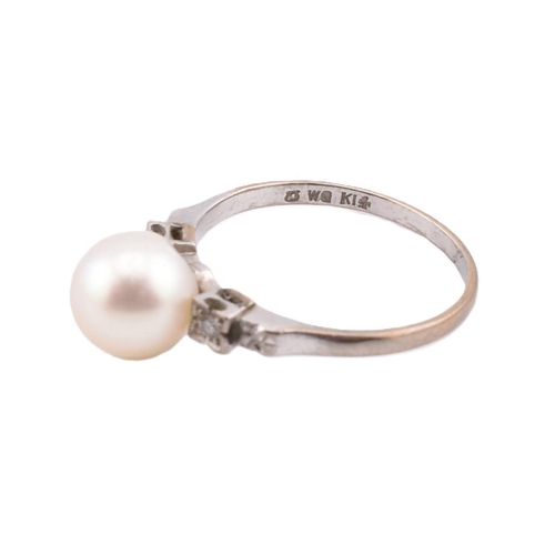 403 - A 14ct gold pearl and diamond ring. The ring set with a central round cultured pearl to decorative, ... 