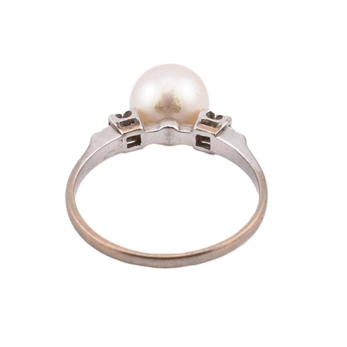 403 - A 14ct gold pearl and diamond ring. The ring set with a central round cultured pearl to decorative, ... 