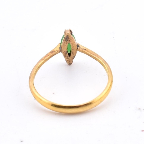 407 - A Chinese 22ct gold and jade ring. The 22ct yellow gold ring set with a single fancy cut jade to pol... 