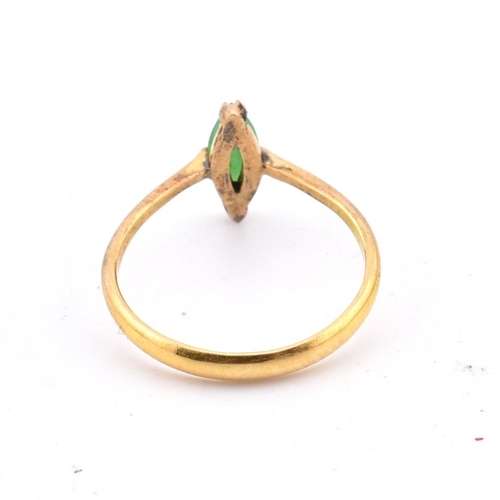 407 - A Chinese 22ct gold and jade ring. The 22ct yellow gold ring set with a single fancy cut jade to pol... 