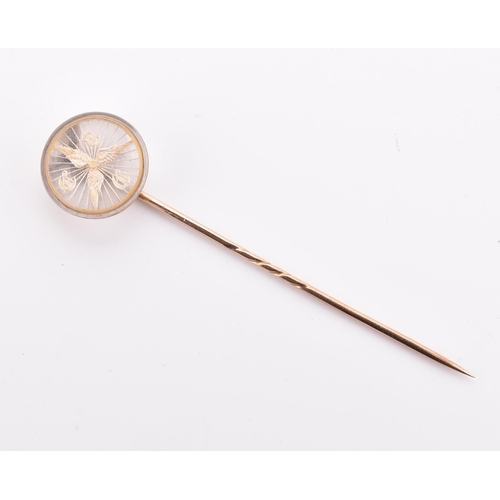 42 - An 18ct gold and Essex crystal cycling club stick pin. The 18ct gold stick pin set with an Essex cry... 