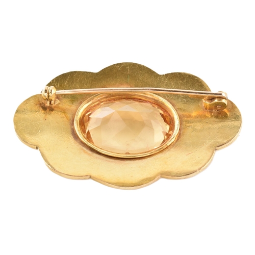 47 - A gold and citrine brooch pin. The brooch in the form of a cloud set with a central oval mixed cut c... 