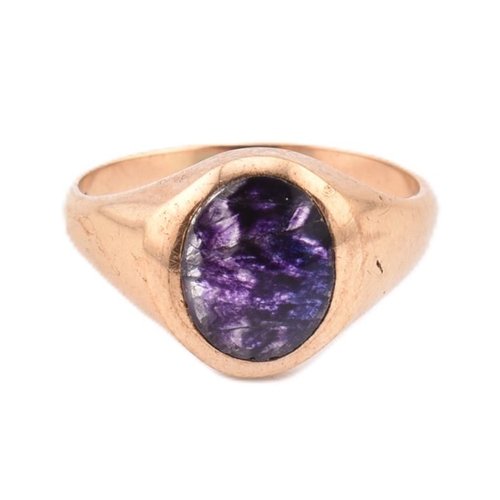 62 - A 9ct gold and blue john signet ring. The 9ct yellow gold signet ring set with a single flush set ov... 