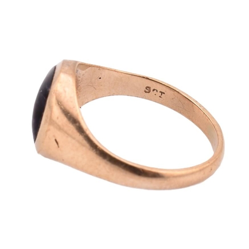 62 - A 9ct gold and blue john signet ring. The 9ct yellow gold signet ring set with a single flush set ov... 