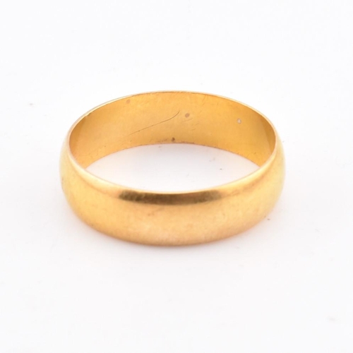 64 - A hallmarked 22ct gold band ring. The 22ct yellow gold band ring hallmarked for Birmingham, 1968. Ma... 