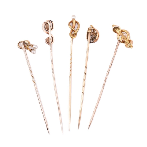 66 - A collection of 15ct gold and 9ct gold stick pins. The stick pins to include four 15ct gold and pear... 