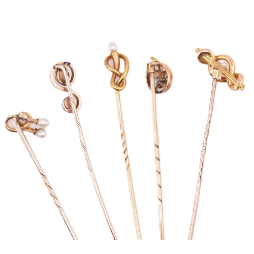 66 - A collection of 15ct gold and 9ct gold stick pins. The stick pins to include four 15ct gold and pear... 