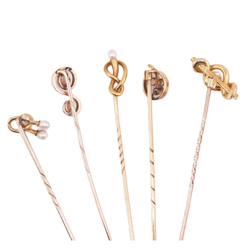 66 - A collection of 15ct gold and 9ct gold stick pins. The stick pins to include four 15ct gold and pear... 