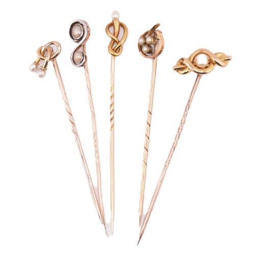 66 - A collection of 15ct gold and 9ct gold stick pins. The stick pins to include four 15ct gold and pear... 