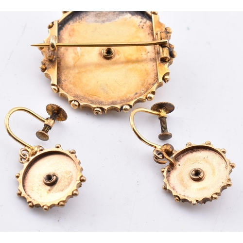 69 - A Victorian brooch and earring set. The antique rolled gold jewellery suite comprised of a round Etr... 