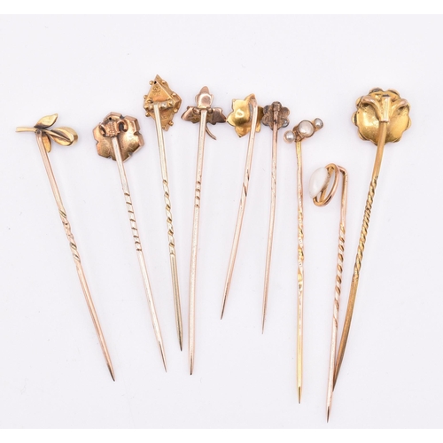 7 - A collection of Victorian and later 9ct gold and gem set stick pins. The lot of nine 9ct gold stick ... 