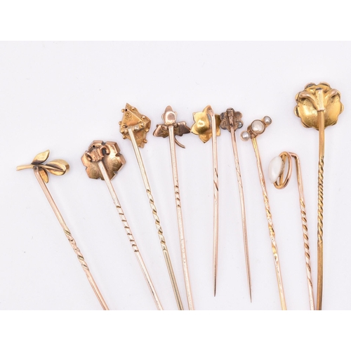 7 - A collection of Victorian and later 9ct gold and gem set stick pins. The lot of nine 9ct gold stick ... 