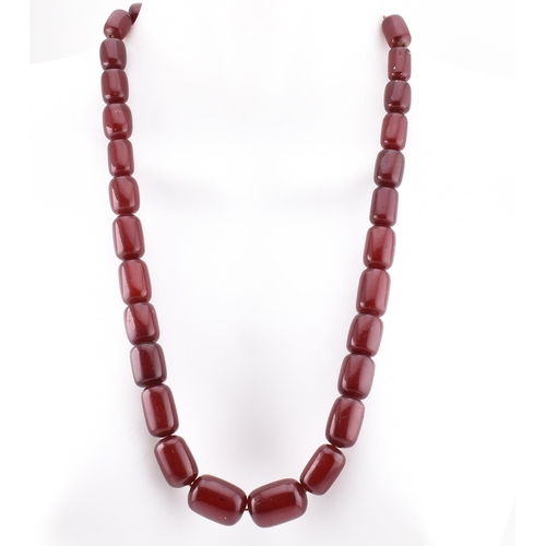 70 - A vintage cherry amber Bakelite bead necklace. The vintage cherry bakelite necklace strung with thir... 