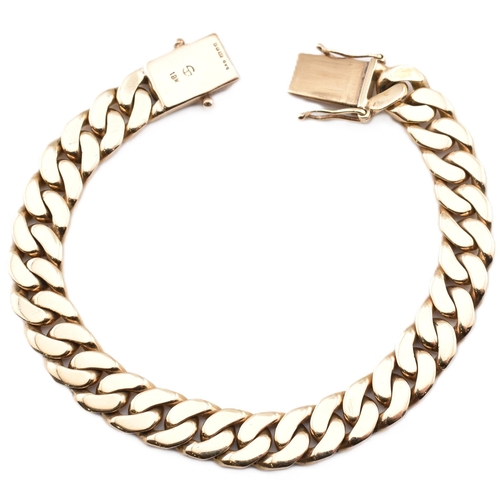 72 - A hallmarked 9ct gold curb link chain bracelet. The 9ct yellow gold curb link chain bracelet having ... 