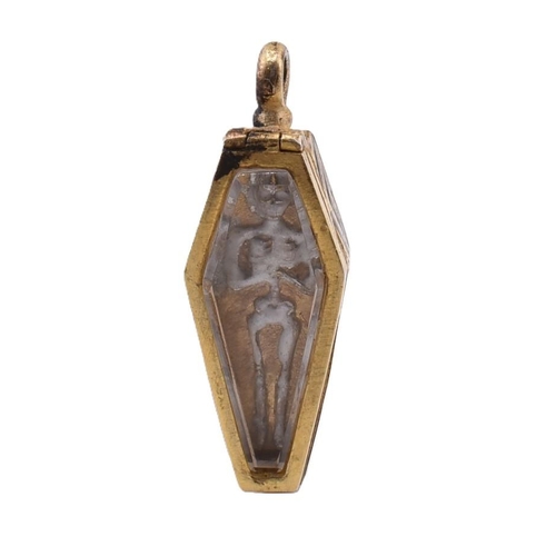 77 - A gilt and enamel coffin locket pendant. The gilt locket pendant in the form of a coffin having rock... 