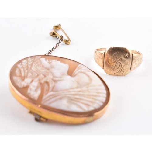 89 - A gold signet ring together with a carved shell cameo brooch pin marked 9ct.  The ring unmarked test... 