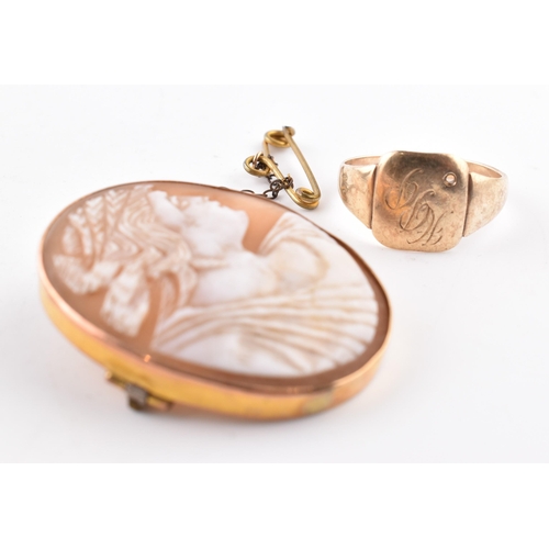 89 - A gold signet ring together with a carved shell cameo brooch pin marked 9ct.  The ring unmarked test... 