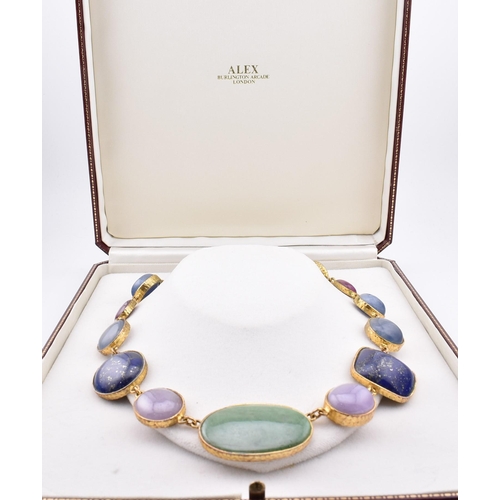 9 - A 1970s gem set parcel gilt necklace. The necklace strung with graduating bezel set cabochons of Jad... 