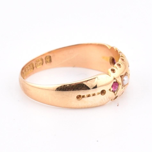 94 - A hallmarked 15ct gold ruby and pearl gypsy ring. The 15ct yellow gold ring set with three graduatin... 