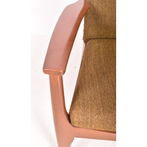 121 - Parker Knoll - a vintage mid century teak wood framed upholstered armchair. The chair featuring gree... 