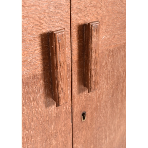 130 - Heals of London - a vintage 20th century 1930s Art Deco limed oak wardrobe. The wardrobe having two ... 