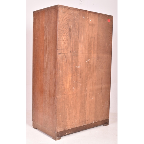 130 - Heals of London - a vintage 20th century 1930s Art Deco limed oak wardrobe. The wardrobe having two ... 