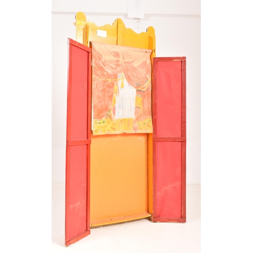 135 - A large early 20th century circa 1900 hand painted wooden Guignol puppet theatre. The theatre having... 