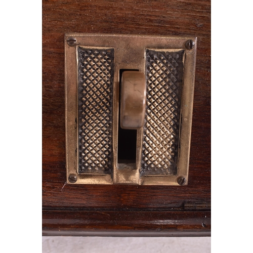 140 - National - an early 20th century oak cased time recorders clocking in machine. The glazed clock face... 